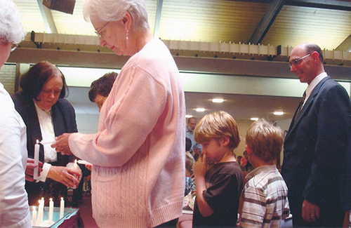 Rev. Mary Moore Lighting Candles