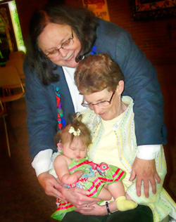Rev. MaryMoore with baby and grandmother
